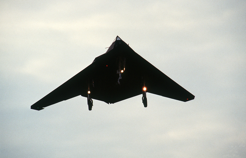 An underside view of an F-117A Stealth fighter aircraft from the 37th Tactical Fighter Wing