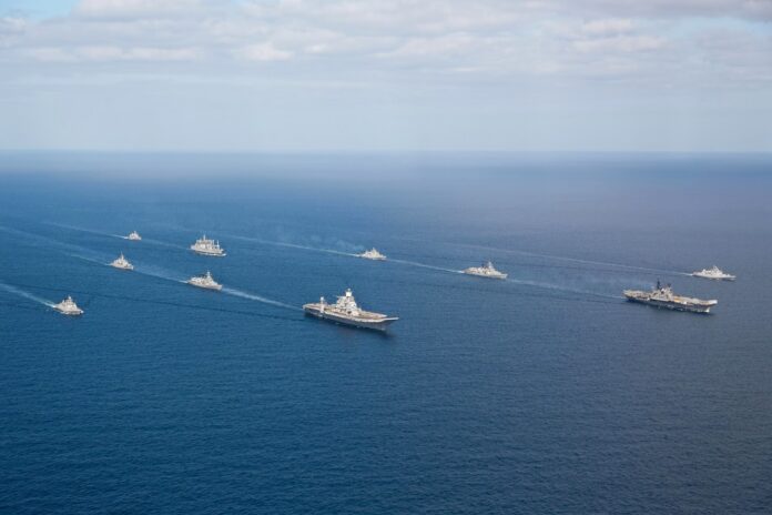 Indian Navy flotilla of Western Fleet escort INS Vikramaditya (R33) and INS Viraat (R22) in the Arabian Sea
