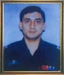 A passport size photo of Major Sudhir Walia of the Indian Army in his uniform.